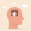 Mind prison. Businessman in human head being in jail, lack of creativity, restrictions on the freedom of thought