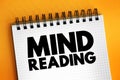 Mind reading - ability to discern the thoughts of others without the normal means of communication, text concept on notepad