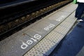 Mind the step sign on railway platform floor