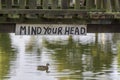 Mind Your Head - low river bridge sign