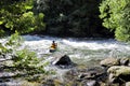 Unknown canoeist, whitewater canoeing at the Minden Wild Water Preserve. Royalty Free Stock Photo