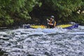 Unknown canoeist, whitewater canoeing at the Minden Wild Water Preserve. Royalty Free Stock Photo