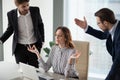 Mindful calm woman boss meditating at work ignoring angry colleagues Royalty Free Stock Photo