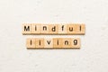 mindful living word written on wood block. mindful living text on table, concept Royalty Free Stock Photo