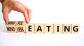 Mindful or mindless eating symbol. Doctor turns cubes and changes words mindless eating to mindful eating. Beautiful white Royalty Free Stock Photo