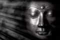 Mindful monochrome buddha face with mystical heavenly light. Spritual enlightenment Royalty Free Stock Photo