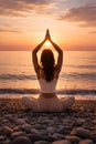 Mindful Yoga Practice At Sunrise Facing The Ocean In Tranquil Natural Setting Royalty Free Stock Photo