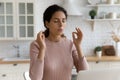 Mindful young woman calming down in stressful situation. Royalty Free Stock Photo