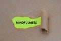 Mindfulness word written under torn paper image Royalty Free Stock Photo
