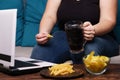 Mindless snacking, overeating, lack of physical activity Royalty Free Stock Photo