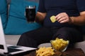 Mindless snacking, overeating, lack of physical activity Royalty Free Stock Photo