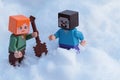 Minecraft LEGO figures of Steve and Alex standing in real deep snow, Alex starts digging snow with shovel.