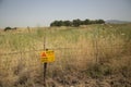 Minefield in Israel with a yellow sign Danger mines