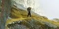 MINER COLLECTING SULFUR ON KAWAH IJEN VOLCANO Royalty Free Stock Photo