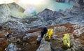 MINER COLLECTING SULFUR ON KAWAH IJEN VOLCANO Royalty Free Stock Photo