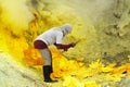 MINER COLLECTING SULFUR ON KAWAH IJEN VOLCANO Royalty Free Stock Photo