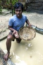 A miner holding pieces of moonstone mined from a pit in Mitiyagoda on the west coast of Sri Lanka.