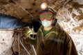 Miner inside a gold mine. Royalty Free Stock Photo