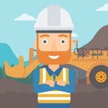 Miner with mining equipment on background.