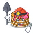 Miner pancake with strawberry mascot cartoon