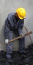 Miner using a pickaxe Royalty Free Stock Photo