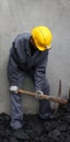 Miner using a pickaxe Royalty Free Stock Photo