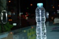 Mineral drinking water transparent plastic bottle reflecting close up Royalty Free Stock Photo