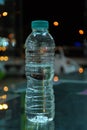 Mineral drinking water transparent plastic bottle reflecting close up Royalty Free Stock Photo