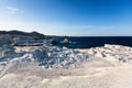 Mineral formations on the coast of Milos island Moon landscape Aegean sea Royalty Free Stock Photo