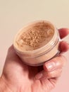 mineral foundation powder in hand