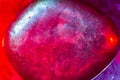 Mineral gem colorfully illuminated in macro capture showing abstract space-type details