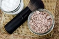 Mineral homemade powder foundation or dry shampoo in a grass jar. DIY cosmetics. Close up