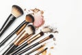 mineral makeup brushes laid out on white background