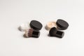Mineral makeup powder twist seal sifter isolated on white background with brush. Many beige foundation powder. Skin tone
