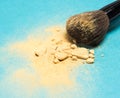 Mineral shimmer powder golden color with makeup brush Royalty Free Stock Photo