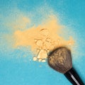 Mineral shimmer powder golden color with makeup brush Royalty Free Stock Photo