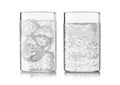 Mineral sparkling water with ice cubes and bubbles on white background Royalty Free Stock Photo