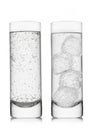 Mineral sparkling water with ice cubes on white background in highball glasses Royalty Free Stock Photo