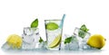 Mineral water in a glass with ice cubes and lemon stands amidst piled up ice cubes with mint leaves. isolated as a freeze frame ag Royalty Free Stock Photo