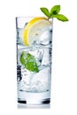 Mineral water in a glass with ice cubes and a slice of lemon isolated as a freeze frame against a white background. Generative Ai Royalty Free Stock Photo