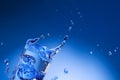 Mineral water splashing out from glass Royalty Free Stock Photo