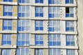 Mineral wool and plaster applied on new multi-storey building facade. Insulation for thermal protection to the shell of the house Royalty Free Stock Photo