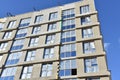 Mineral wool and plaster applied on new multi-storey building facade. Insulation for thermal protection to the shell of the house Royalty Free Stock Photo