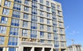 Mineral wool and plaster applied on new multi-storey building facade. Insulation for thermal protection to the shell of the house Royalty Free Stock Photo