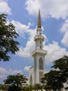 A minerat of mosque with blue sky and white clouds as the background. Royalty Free Stock Photo