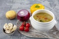 Minestrone, italian vegetable soup with served Turkish ravioli on gray backgrounds