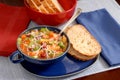 Minestrone soup in blue bowl with italian bread Royalty Free Stock Photo