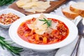 Minestrone soup with cavatappi pasta, beans and vegetables with crispy bread, horizontal, closeup Royalty Free Stock Photo