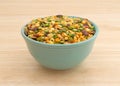 Minestrone soup mix in a bowl on a wood table Royalty Free Stock Photo