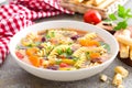 Minestrone soup. Vegetable soup with fresh tomato, celery, carrot, zucchini, onion, pepper, beans and pasta. Dish of italian cuisi Royalty Free Stock Photo